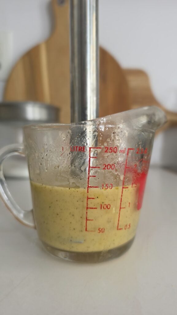 immersion blender after blending the red wine vinaigrette for the easy three-bean salad