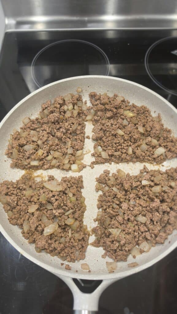 dividing the ground beef into four for the burger bowls