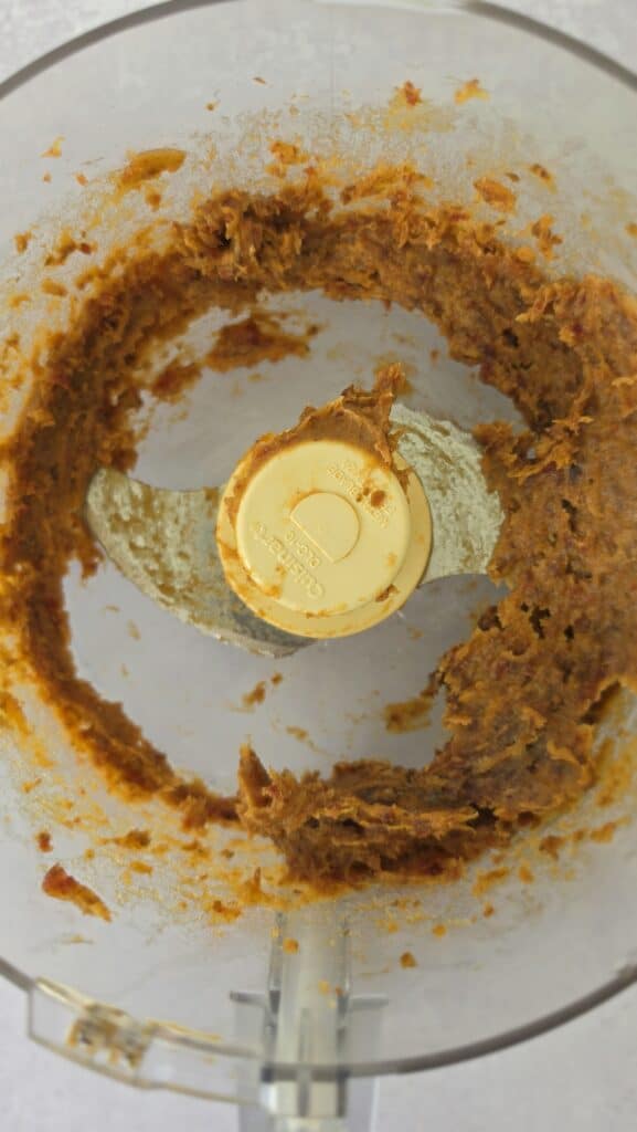 dates pureed in a food processor bowl for Date Caramel Turtles