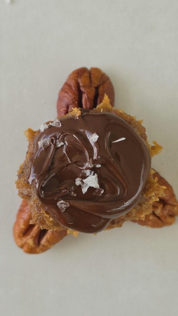 pecans, date caramel, chocolate on top for a date caramel turtle